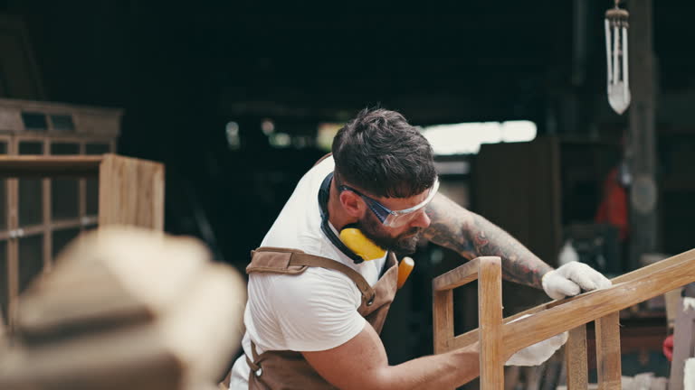 young male carpenter working.